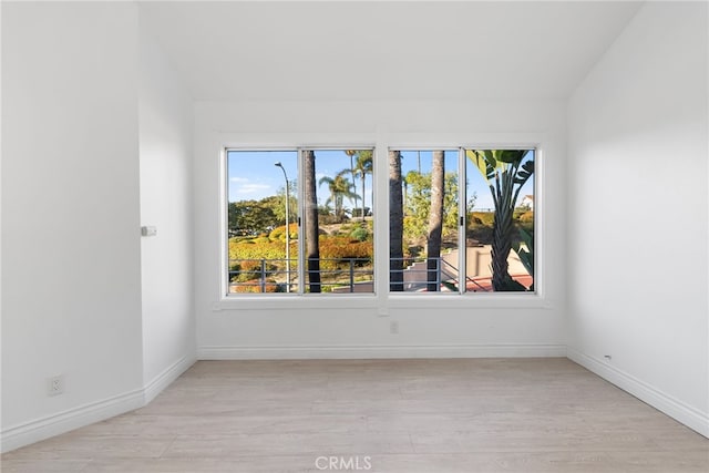 unfurnished room with light wood-type flooring