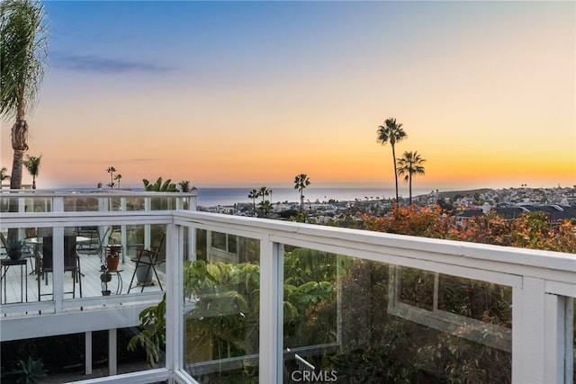 balcony at dusk with a water view