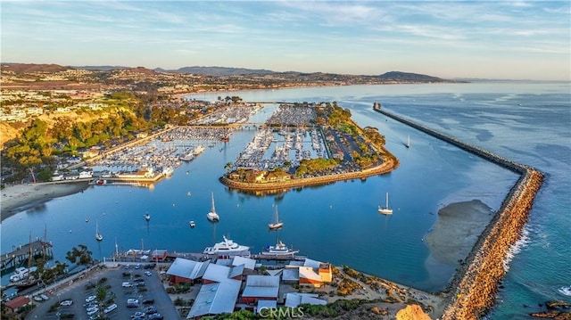 drone / aerial view with a water and mountain view