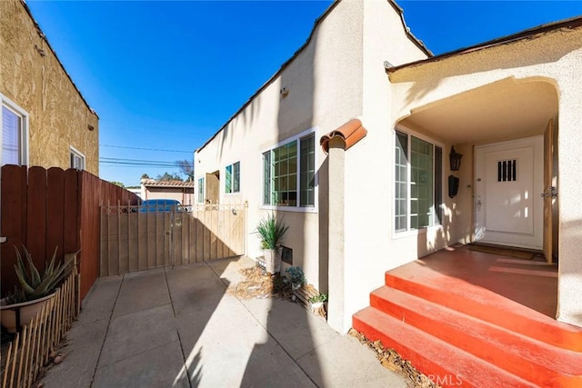 view of side of property featuring a patio area