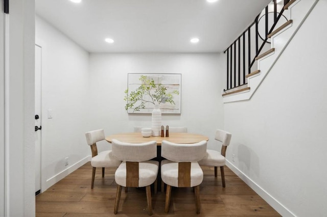 dining area with hardwood / wood-style floors