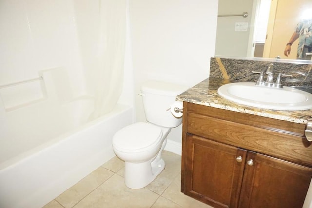 full bathroom featuring tile patterned flooring, vanity, shower / bath combination with curtain, and toilet