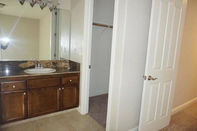 bathroom with vanity and tile patterned flooring