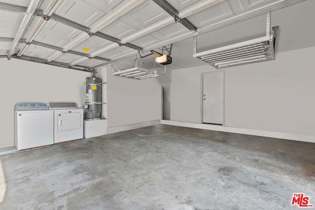 garage with a garage door opener, strapped water heater, and washing machine and dryer