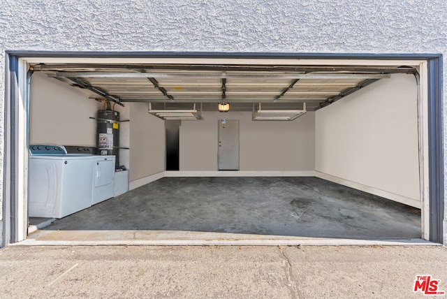 garage with independent washer and dryer and strapped water heater