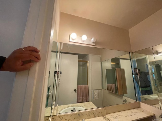 bathroom with vanity and walk in shower