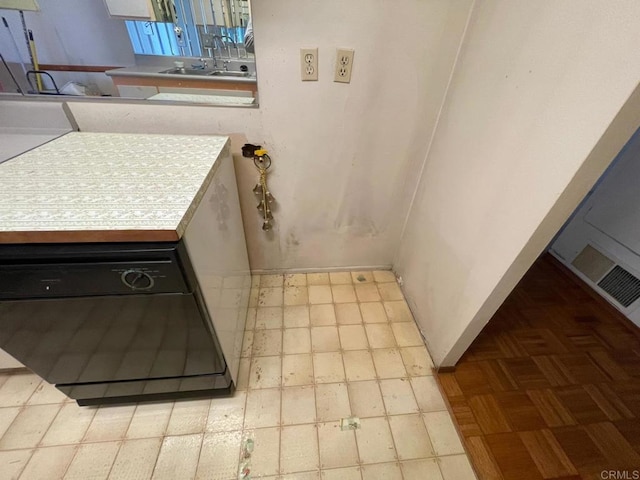 kitchen featuring sink and black dishwasher