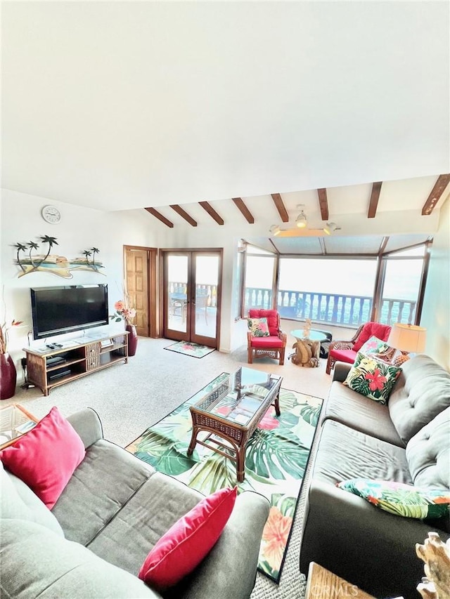 living room featuring beamed ceiling, carpet, and french doors