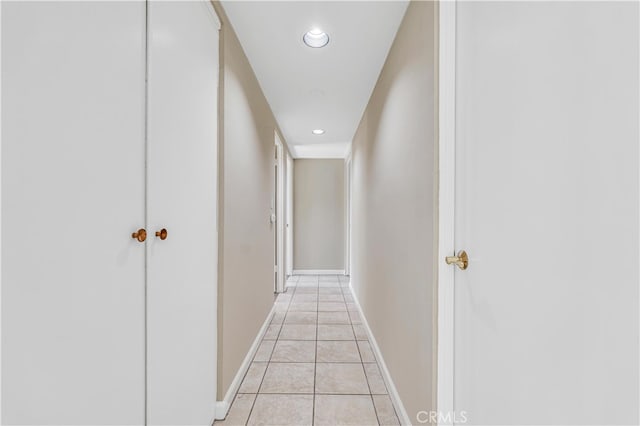 corridor with light tile patterned floors