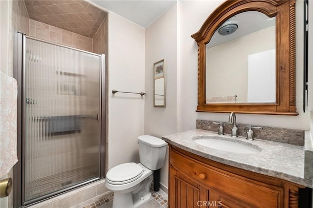 bathroom with vanity, walk in shower, and toilet