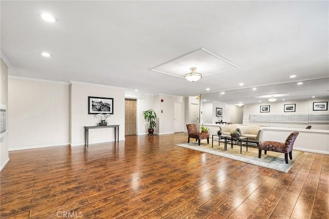 interior space with hardwood / wood-style flooring and crown molding