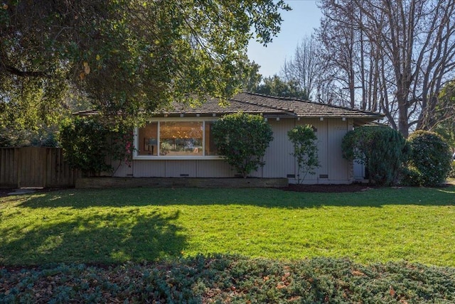 view of property exterior featuring a yard