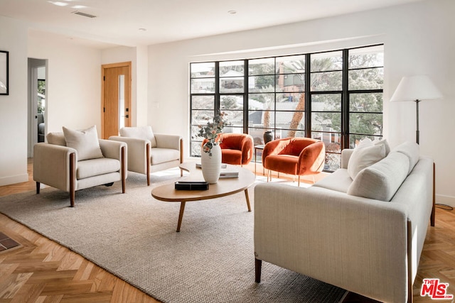 living room with parquet flooring