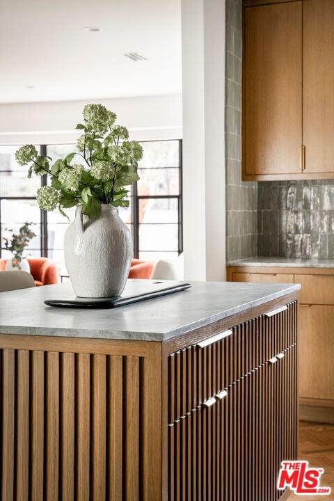 room details featuring parquet flooring and backsplash