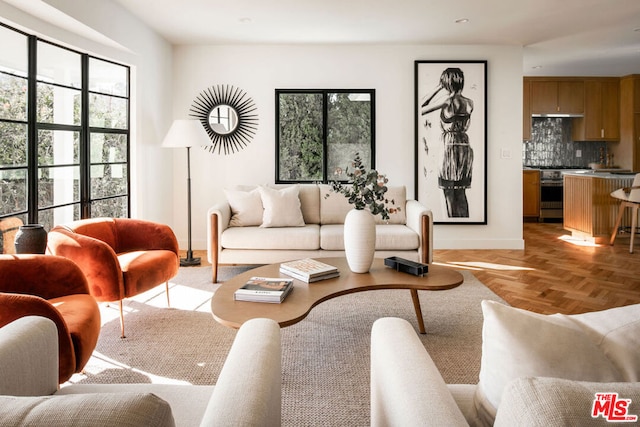 living room featuring light parquet flooring and a wealth of natural light