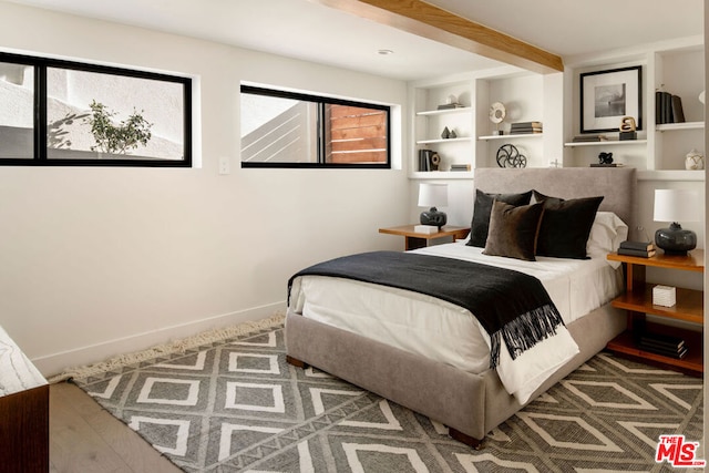 bedroom featuring beam ceiling