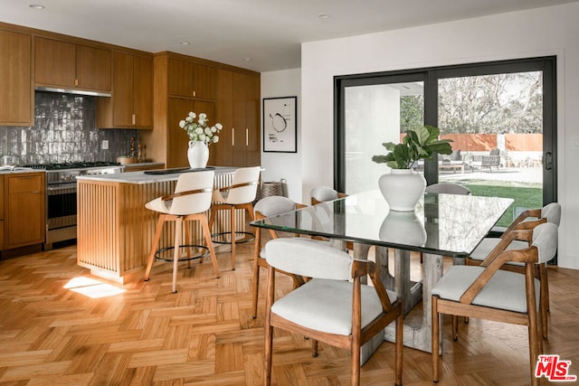 dining area with light parquet flooring