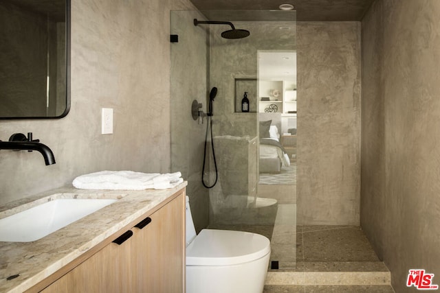 bathroom with vanity, toilet, and walk in shower