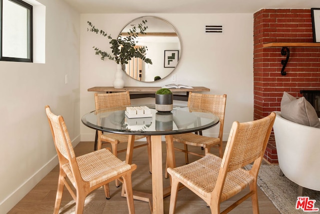 dining area with hardwood / wood-style flooring