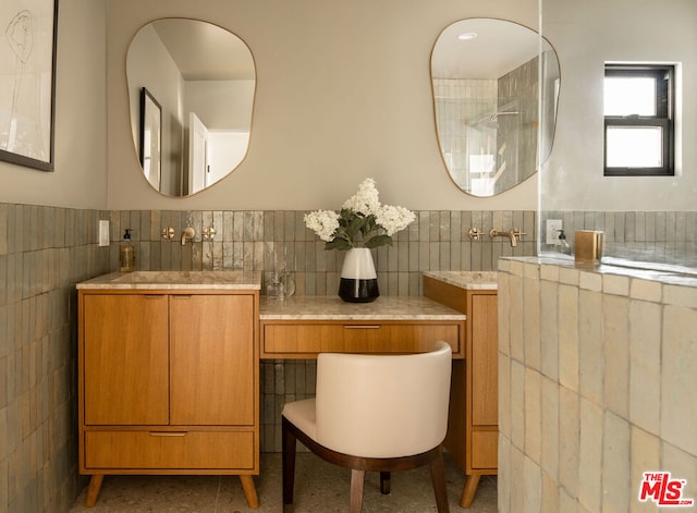 bathroom featuring tile walls and vanity