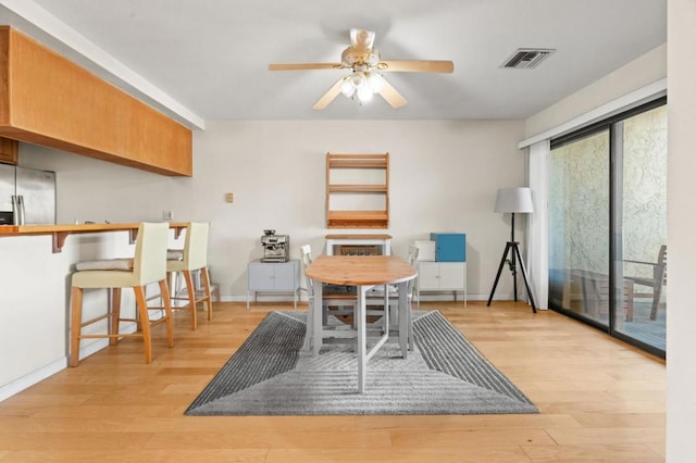 dining room featuring ceiling fan and light hardwood / wood-style floors