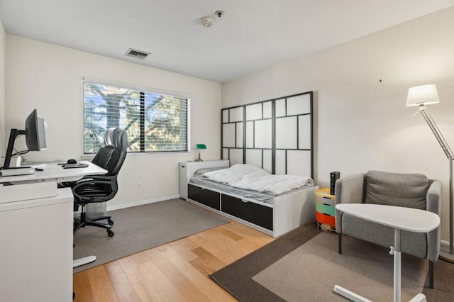 bedroom featuring hardwood / wood-style flooring