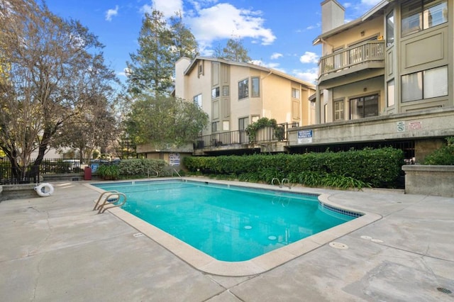 view of swimming pool featuring a patio area