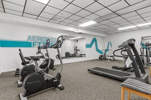 exercise room featuring a paneled ceiling