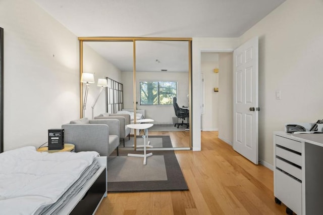 bedroom with hardwood / wood-style flooring