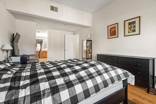 bedroom with light wood-type flooring