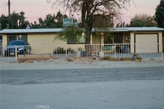 single story home with a garage