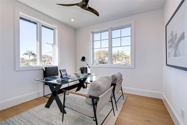 home office featuring ceiling fan and light wood-type flooring