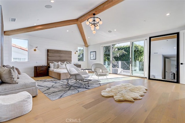 bedroom featuring light hardwood / wood-style flooring, access to outside, lofted ceiling with beams, and wood walls