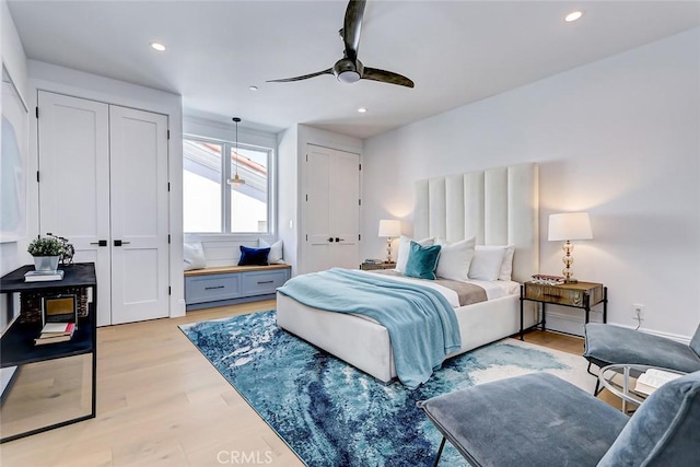 bedroom with ceiling fan and light hardwood / wood-style flooring