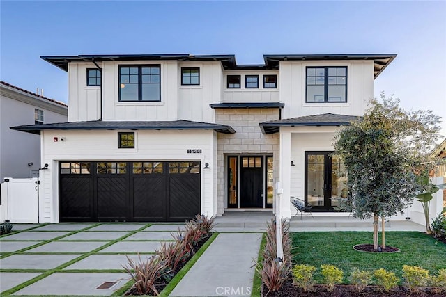 modern farmhouse style home featuring a garage