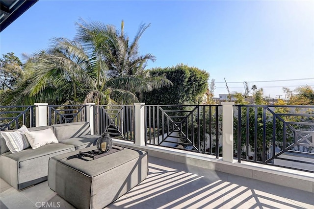 view of patio / terrace with a balcony and an outdoor hangout area