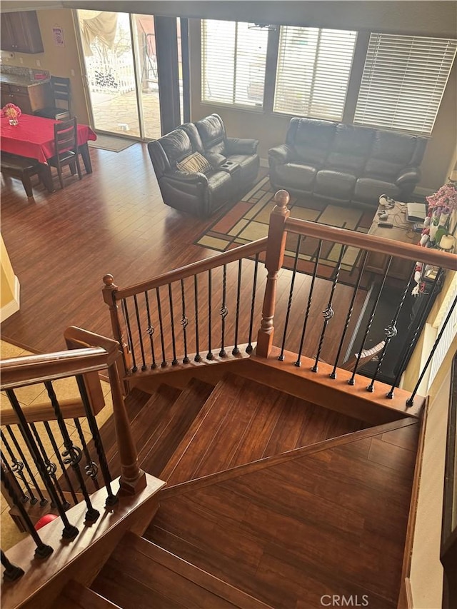 stairs with wood-type flooring