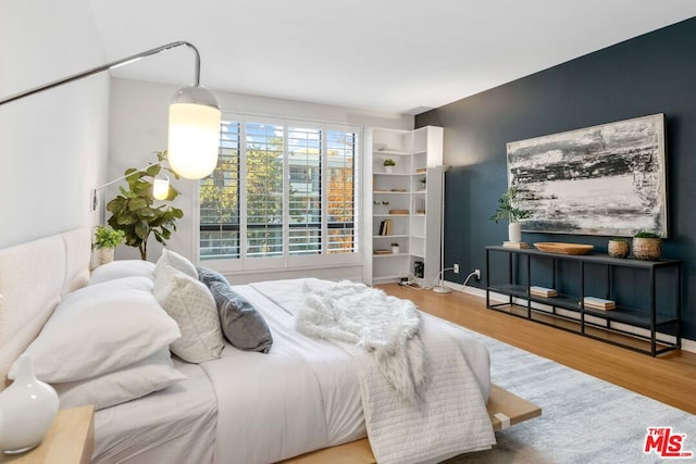 bedroom with hardwood / wood-style flooring