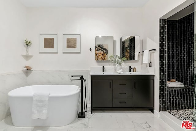 bathroom featuring tile walls, sink, and a bathing tub