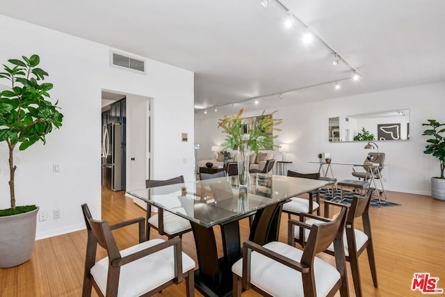 dining room with light hardwood / wood-style floors