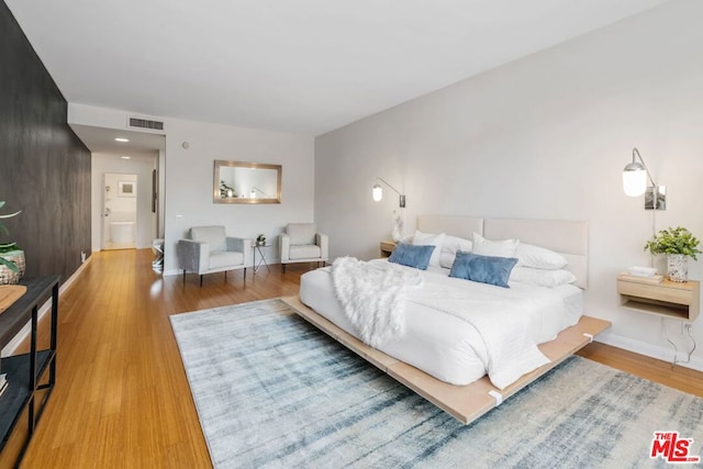 bedroom featuring wood-type flooring