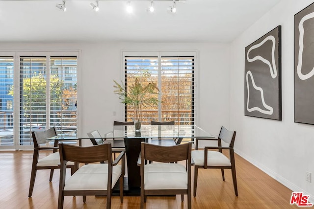 dining space featuring hardwood / wood-style flooring