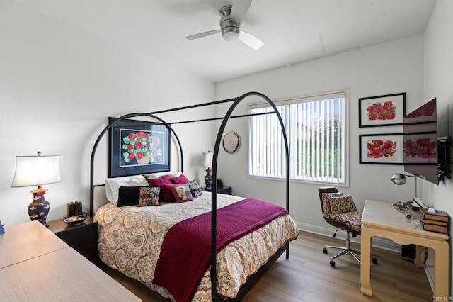 bedroom with wood-type flooring and ceiling fan