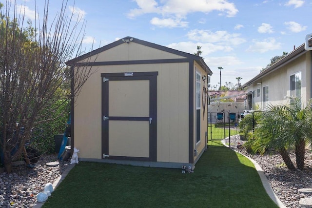 view of outbuilding featuring a lawn