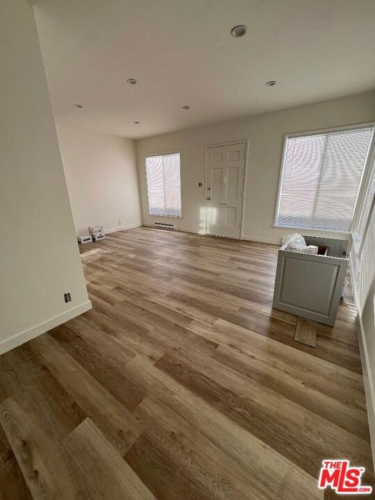 unfurnished living room featuring light hardwood / wood-style floors