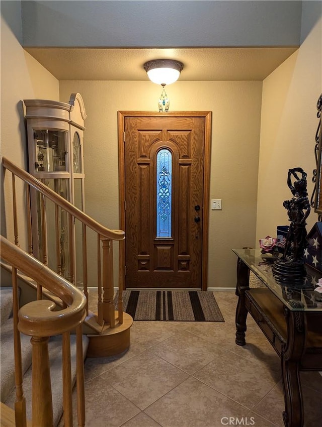 entrance foyer featuring tile patterned flooring