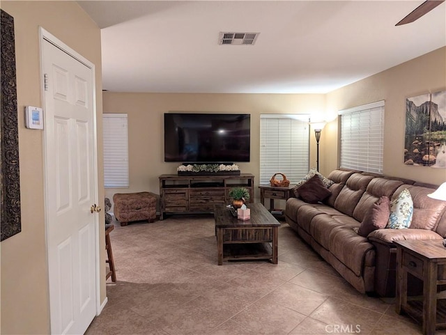 living room with light tile patterned flooring