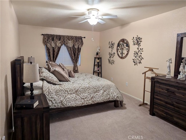 bedroom with light colored carpet and ceiling fan