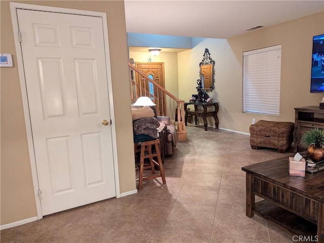 hallway featuring light tile patterned floors