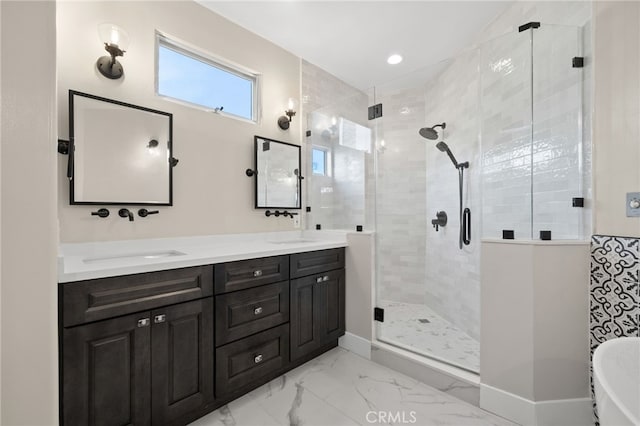 bathroom with a shower with door and vanity